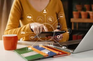 Person using a tablet surrounded by CRM integration and automation icons